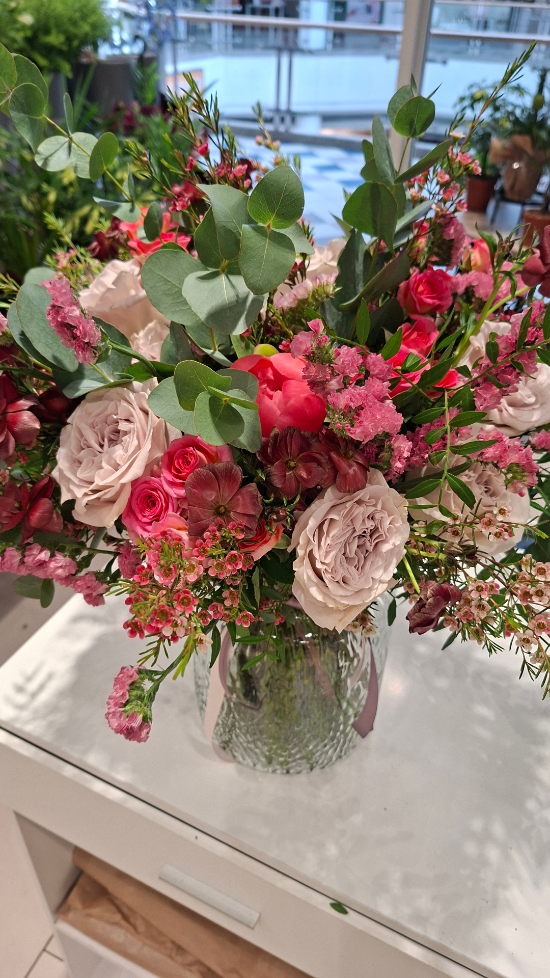 Pink rose, peony and eucalyptus hand-tied bouquet in a glass vase — Feel Drop Co Sutton florist
