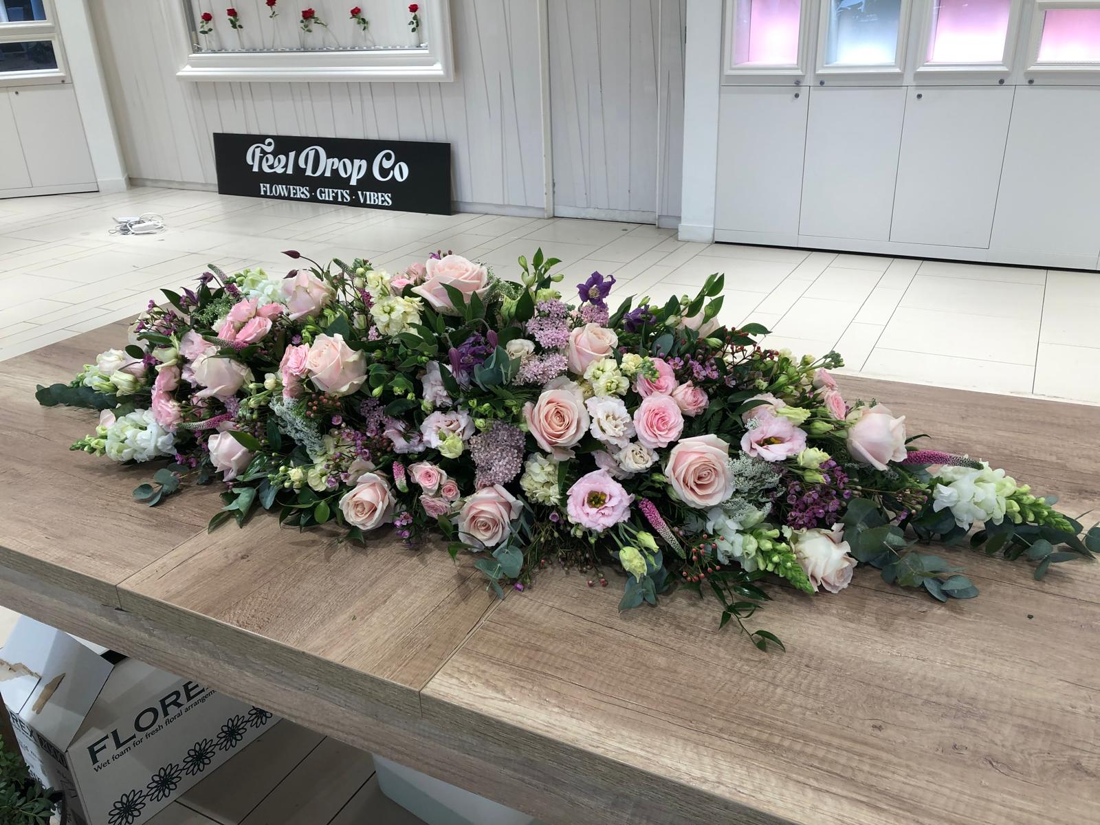 Pink rose casket spray — Feel Drop Co funeral florist